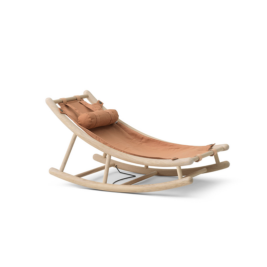 Wooden rocking chair with a cushion on a white background