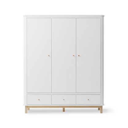 White wardrobe with wooden legs on a white background