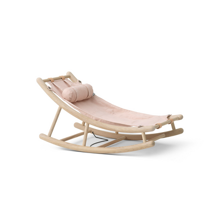 Pink baby swing with beige cushion on a white background