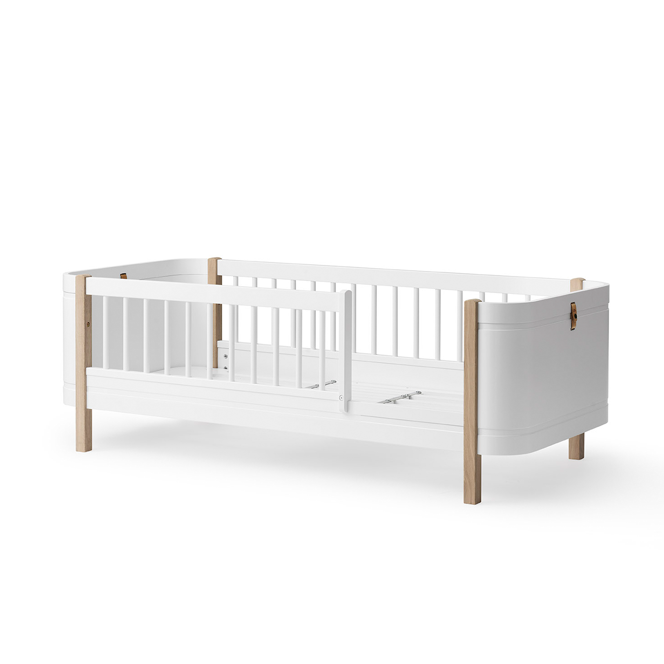 White crib with wooden accents on a white background