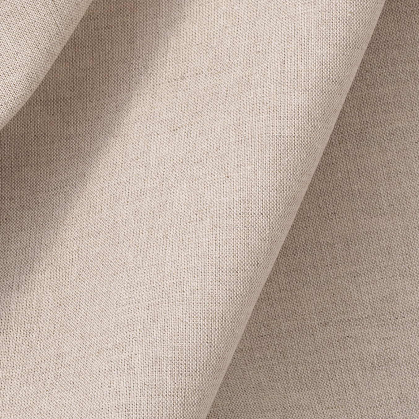 Close-up of beige fabric with a textured pattern