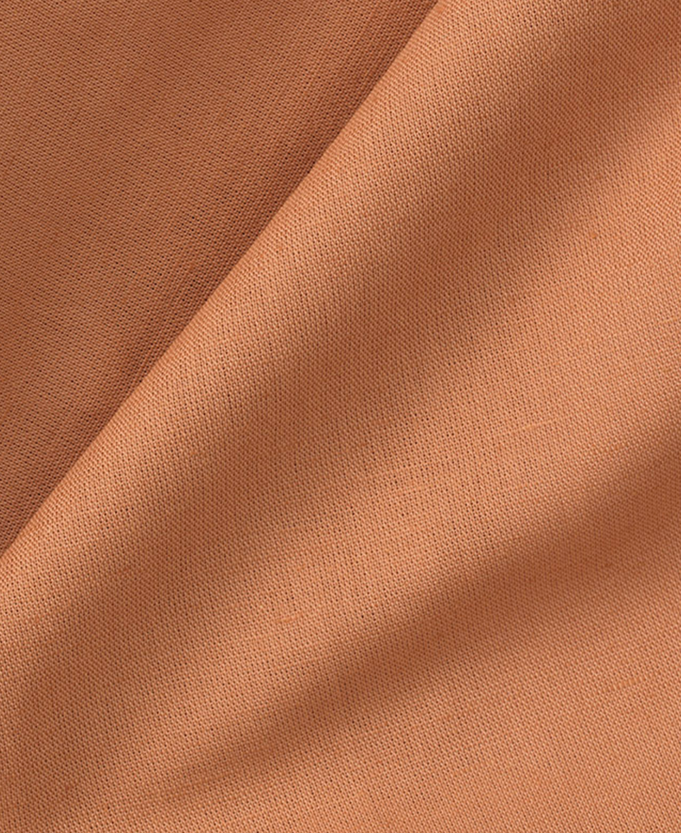 Close-up of brown leather fabric with visible texture