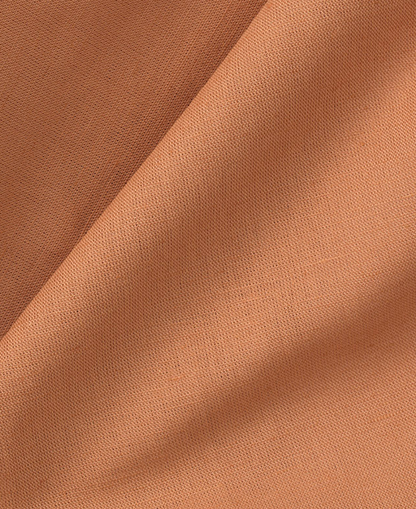Close-up of brown leather fabric with visible texture