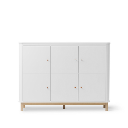 White cabinet with wooden legs on a white background