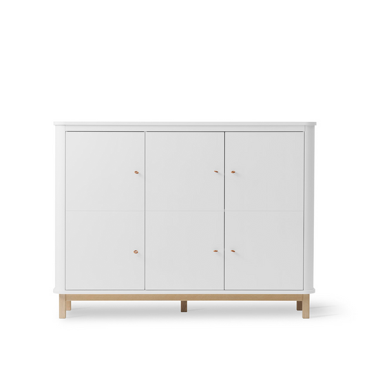 White cabinet with wooden legs on a white background