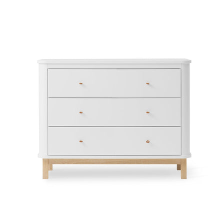 White dresser with wooden legs on a white background