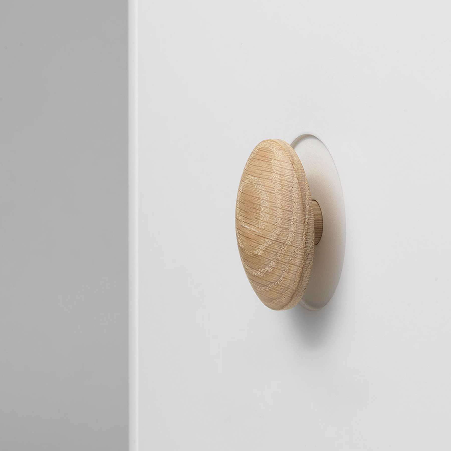 Wooden wall hook on a white background