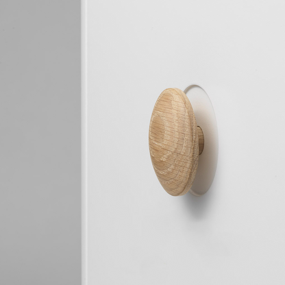 Wooden wall hook on a white background