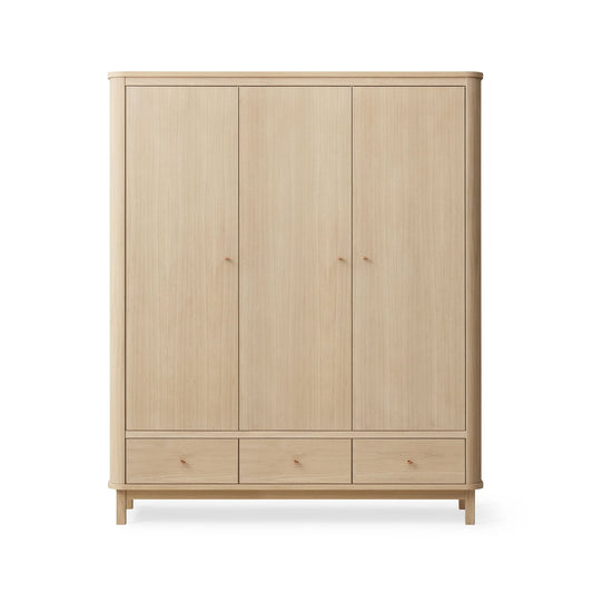 Wooden wardrobe with four doors and two drawers on a white background
