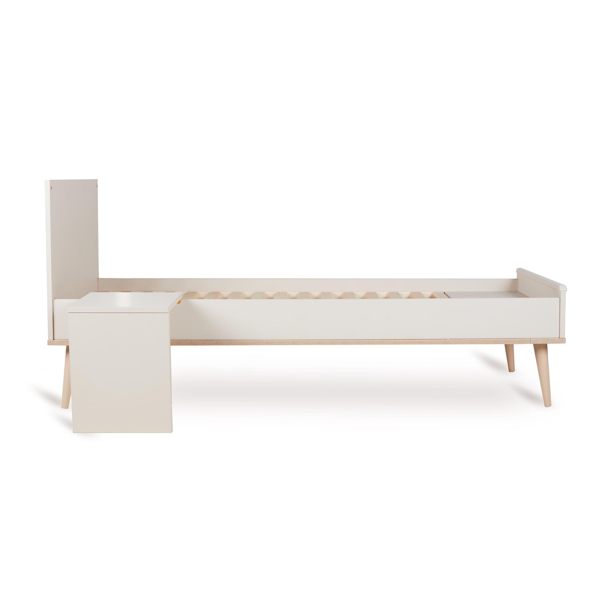 Quax Flow Bed in Clay shown as a toddler bed with end panels, part of the convertible cot system