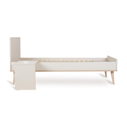Quax Flow Bed in Clay shown as a toddler bed with end panels, part of the convertible cot system