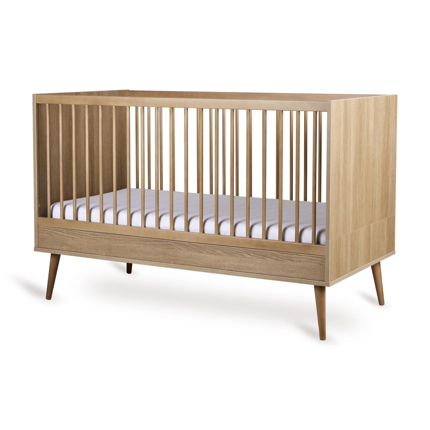 Quax Flow convertible cot bed in honey ash wood, 140 x 70 cm, shown with white mattress