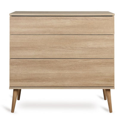 Quax Flow Chest in Honey Ash — front view with push-open drawers	