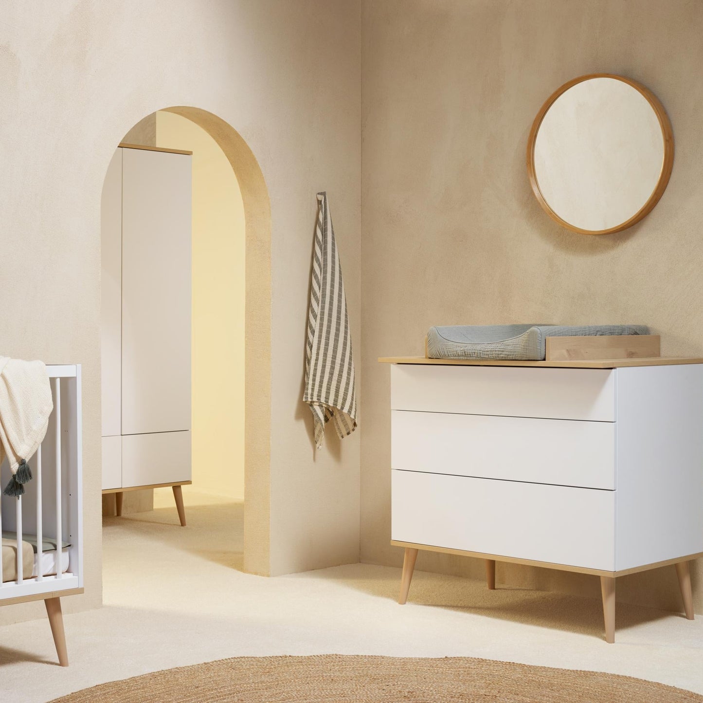 Quax Flow Chest in White styled in a modern nursery setting