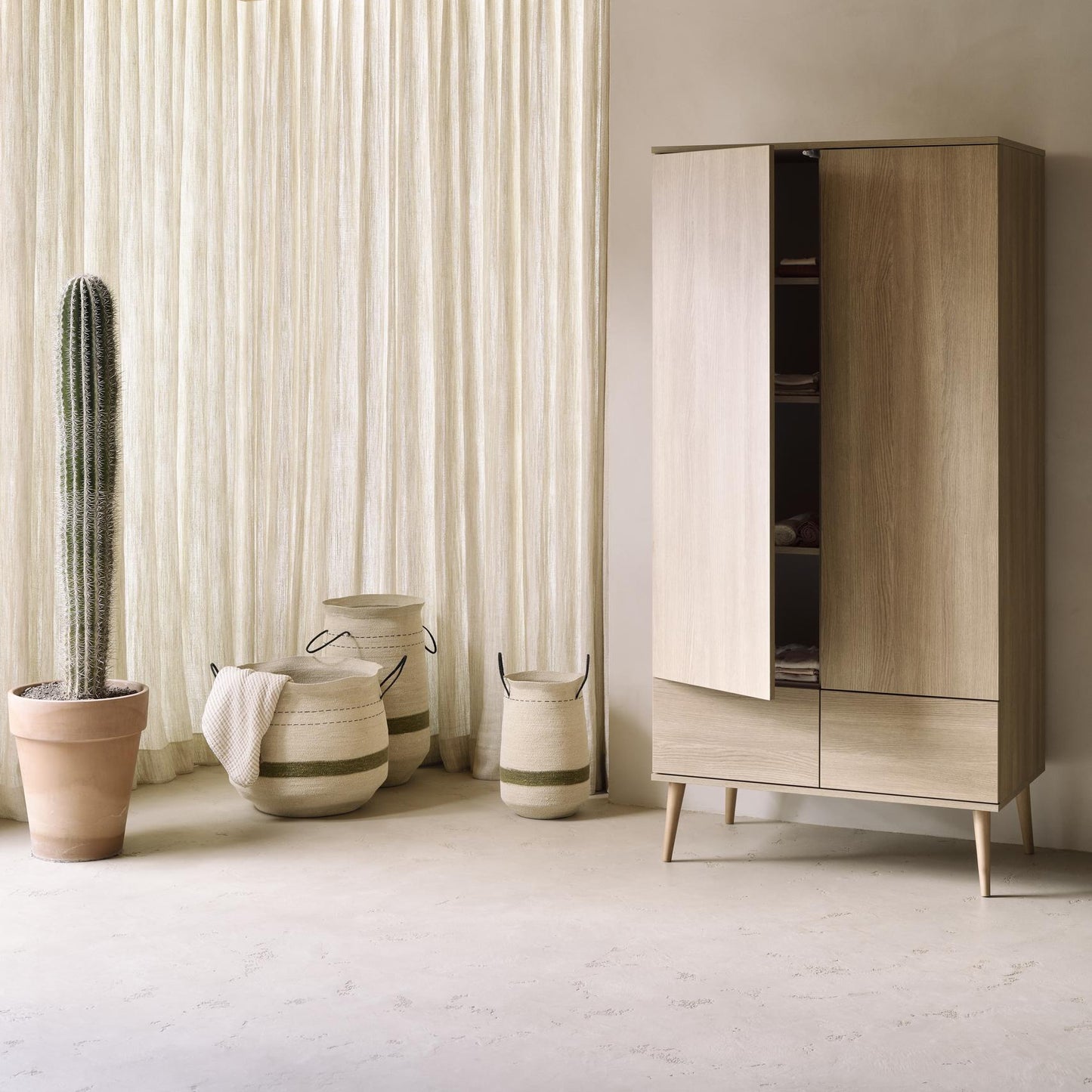 Quax Flow 2 Door Wardrobe in Honey Ash — lifestyle view in nursery setting