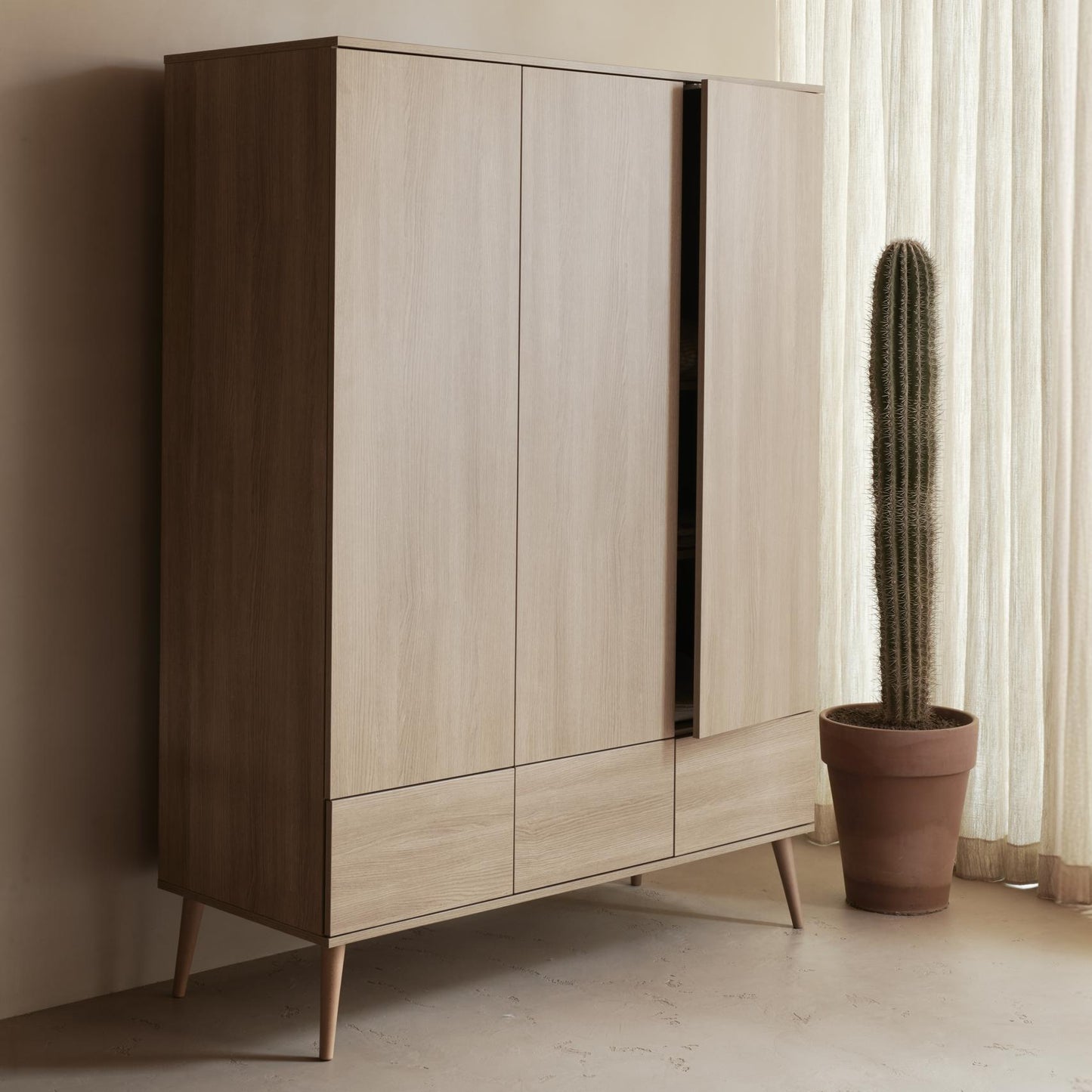 Quax Flow 3 Door Wardrobe in Honey Ash — lifestyle view in nursery setting