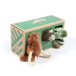Two plush toys, a lion and a dinosaur, in a green box with a white background.