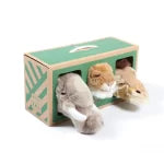 Two small animal plush toys in a green box with leaf designs on a white background