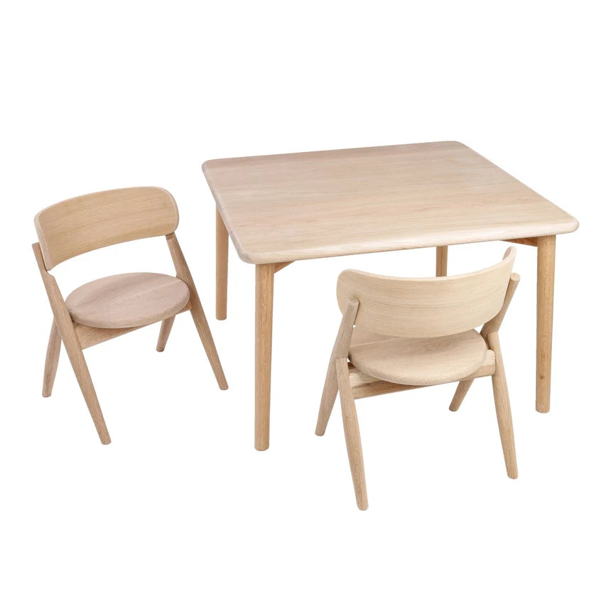 Wooden table and chairs set on a white background