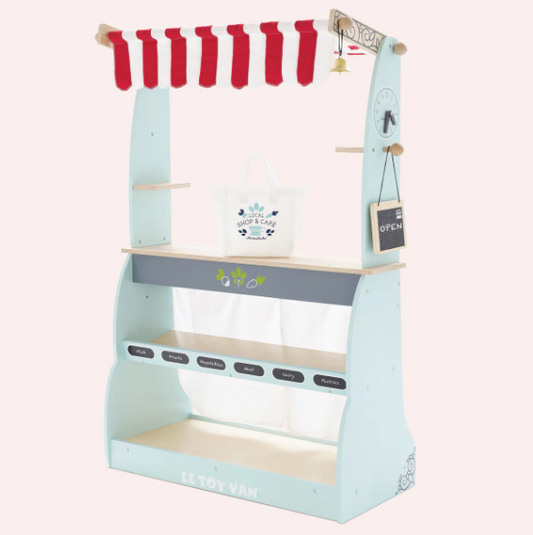 Children's play kitchen set with red canopy and shelves on a white background