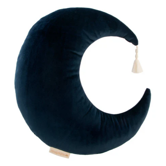 Navy blue crescent moon-shaped pillow with a tassel on a white background